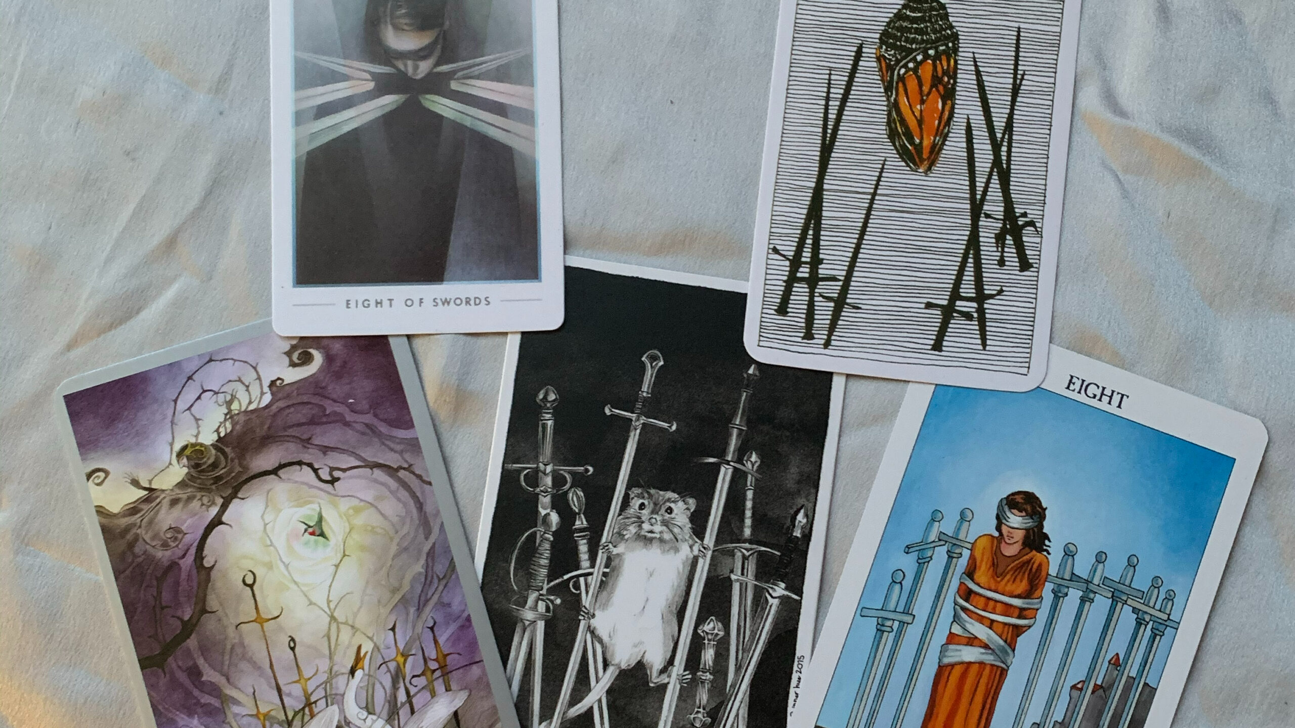 8 of Swords: Comparing Thoth & Rider Waite Tarot Systems